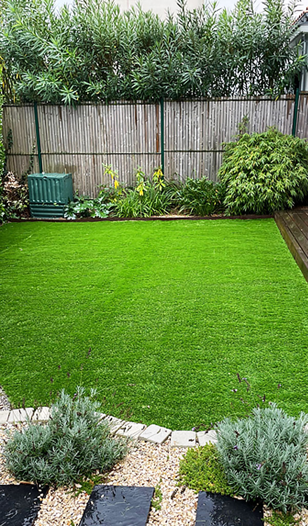 Artificial grass in an enclosed garden