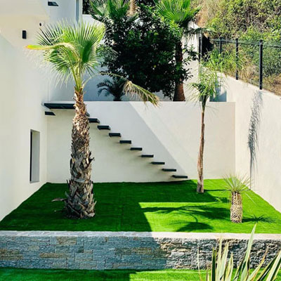 Artificial turf in a landscaped garden