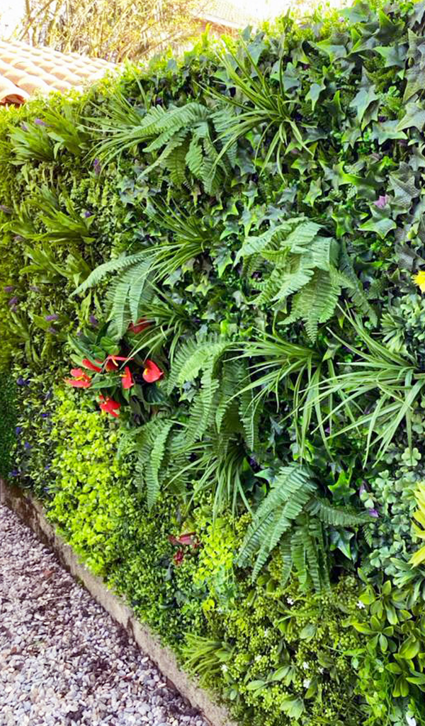 Artificial plant wall on a fence