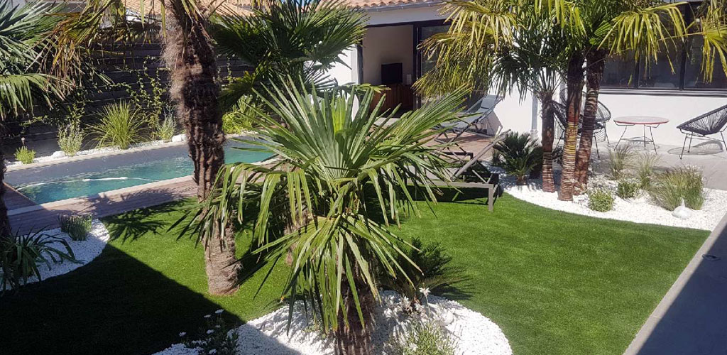 artificial grass in a garden with swimming pool