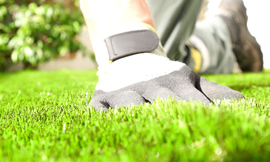 hand on artificial turf